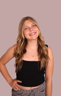 Black square-neck sleeveless tank top, fitted cropped hem.