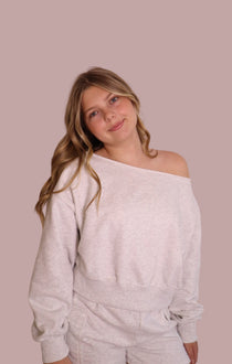 Light gray off-shoulder cropped sweatshirt, long sleeves and relaxed neckline